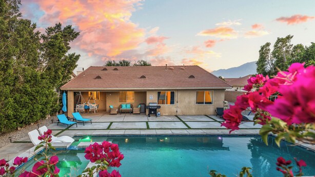 A house with a swimming pool, outdoor furniture, and a patio area. - Estrella Escape, Pool, Spa & Game Room Fun (Desert Hot Springs)