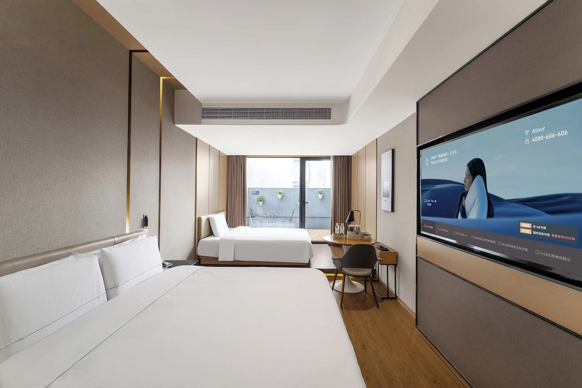 Premium bedding, down comforters, memory foam beds, free minibar