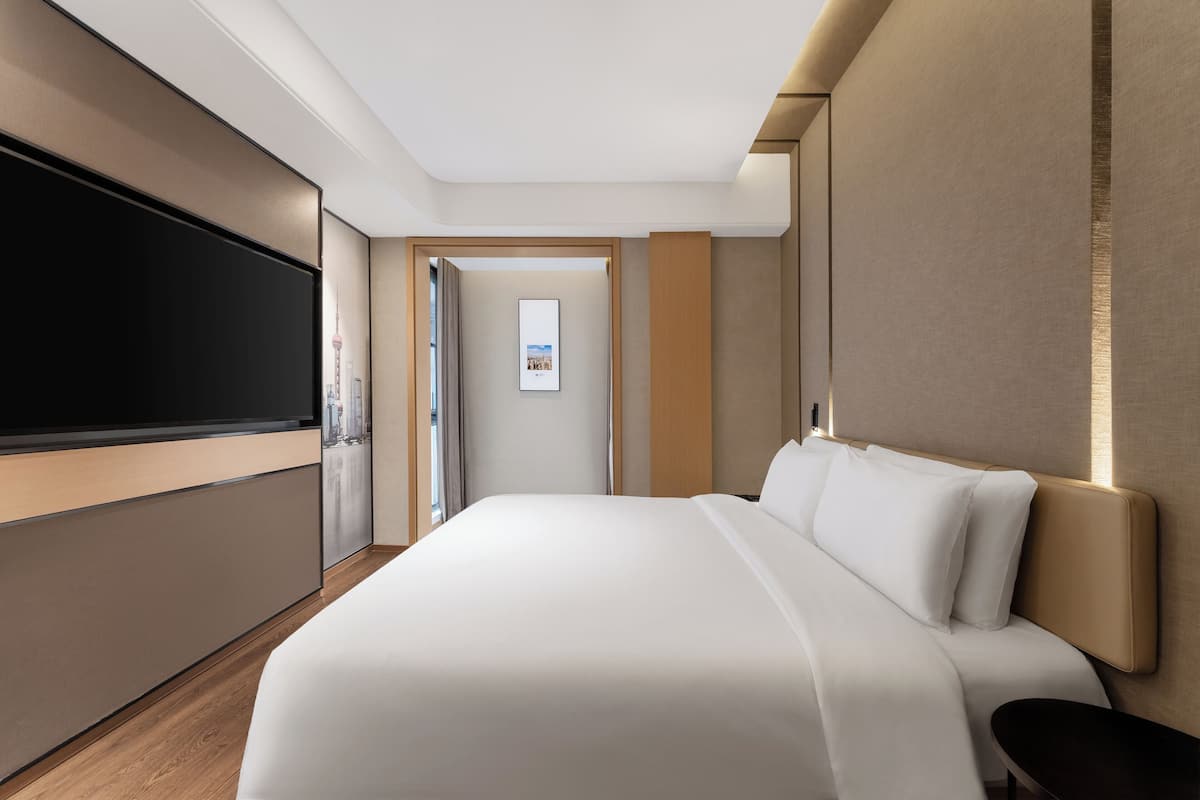 Premium bedding, down comforters, memory foam beds, free minibar