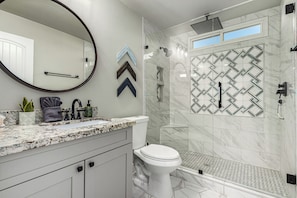 Shower, hair dryer, towels, toilet paper