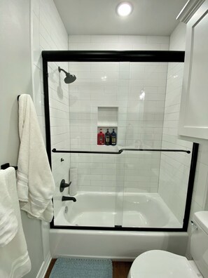 Shower, hair dryer, towels, soap