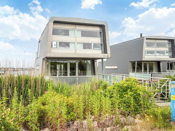 A modern two-story building with large windows and a flat roof. - 5 Star Holiday Home in Hemmet (Hemmet)