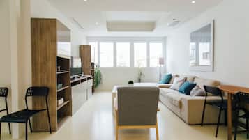 Apartment, City View | Living area | Flat-screen TV