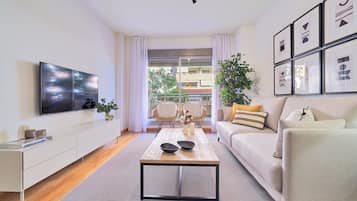 Apartamento família, 3 quartos | Área de estar