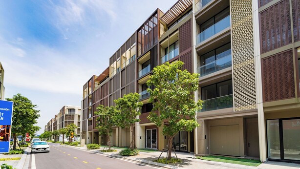 A modern building with multiple floors, large windows, and a clean, organized facade. - The Global City - Jenny Residences (Ho Chi Minh City)