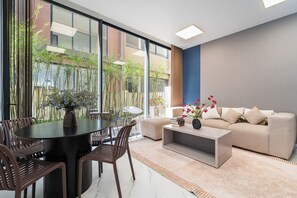 Deluxe House, Multiple Bedrooms, Balcony, City View | Living area | 32-inch Smart TV with cable channels - The Global City - Jenny Residences (Ho Chi Minh City)