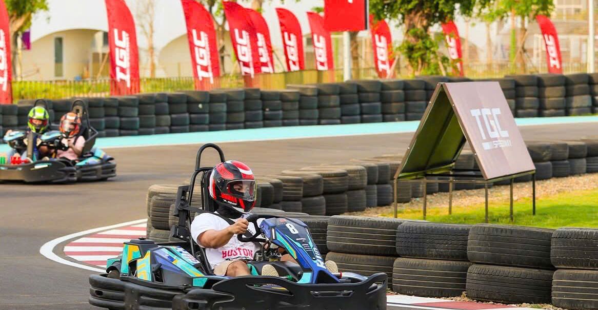 A go-kart track with a sign that reads "TGC".
