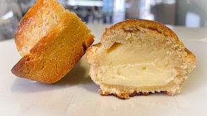 A half-eaten pastry with a creamy filling, placed on a white surface. - Little apartment at André's a few minutes from the center of Lecce (Lecce)
