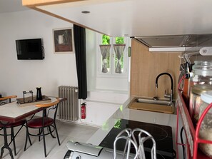 Fridge, microwave, stovetop, coffee/tea maker