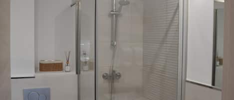 Shower, hair dryer, towels, soap
