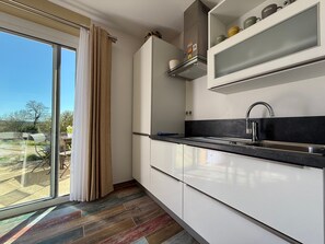 Fridge, microwave, stovetop, coffee/tea maker