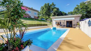 A rectangular swimming pool with a white edge, surrounded by a beige deck. - 4 Mi to Downtown Chattanooga: Vibrant Studio (Chattanooga)