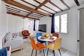City Apartment, Non Smoking, Courtyard View | Living area | 40-inch Smart TV with satellite channels - Chic 1BR Steps from Montorgueil (Paris)