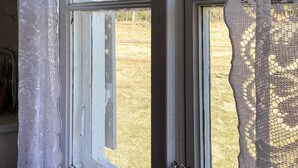 A window with a view of a grassy field and trees. - 4 Star Holiday Home in Sandhem (Mullsjö)