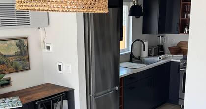 Cozy studio with modern kitchen in unit laundry and AC close to hiking trails.