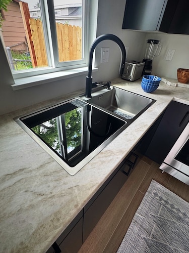 Cozy studio with modern kitchen in unit laundry and AC close to hiking trails.