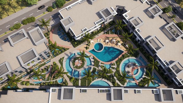 Vista aérea de un moderno complejo turístico con varias piscinas, palmeras y una zona central con tumbonas.