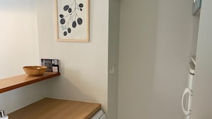 A compact kitchen with a wooden countertop, a dishwasher, a trash bin, and a framed botanical print on the wall. - House 6 persons.2 bedrooms, 1 living room (Monflanquin)