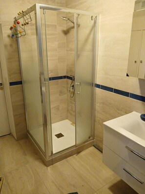 Shower, hair dryer, towels, soap