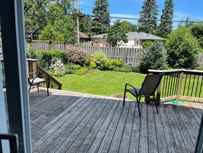 Cheerful 4 bedroom house with large deck and garden in walkable neighbourhood.