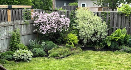 Cheerful 4 bedroom house with large deck and garden in walkable neighbourhood.