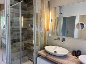 Shower, hair dryer, towels, toilet paper