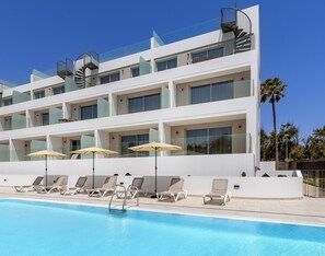 Outdoor pool, open 10:00 AM to 7:00 PM, pool loungers