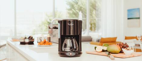 Microwave, dishwasher, coffee/tea maker, cookware/dishes/utensils
