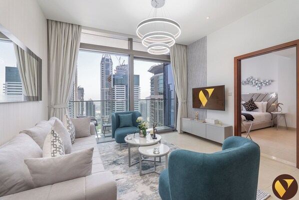 Luxury Apartment, Balcony | Living area | 65-inch Smart TV with cable channels - Marina Gate Pool view with balcony Beach (Dubai)