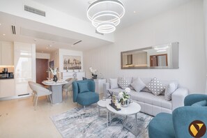 Luxury Apartment, Balcony | Living area | 65-inch Smart TV with cable channels - Marina Gate Pool view with balcony Beach (Dubai)