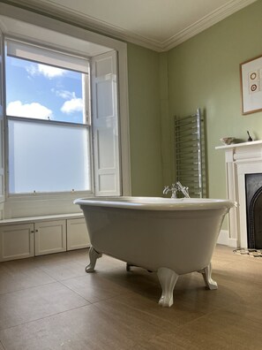 Shower, hair dryer, towels, toilet paper