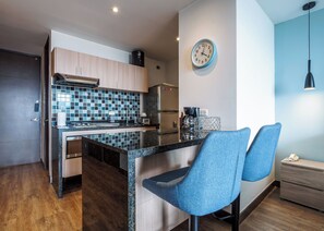 Fridge, microwave, stovetop, coffee/tea maker