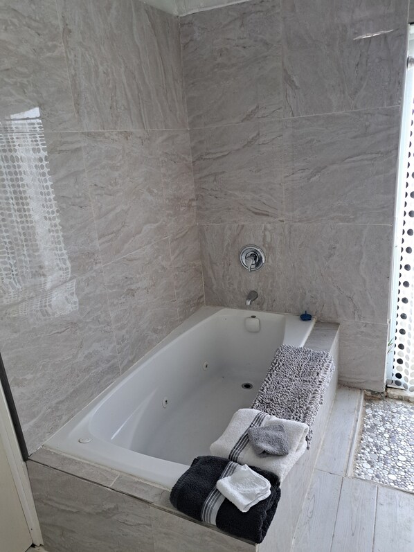 Jetted tub, towels, soap, toilet paper
