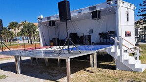 A stage with a speaker and a small audience area.