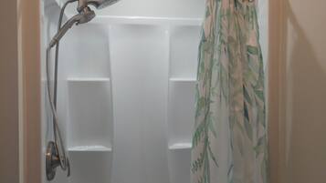 Shower, hair dryer, towels, toilet paper