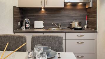Fridge, highchair, cookware/dishes/utensils