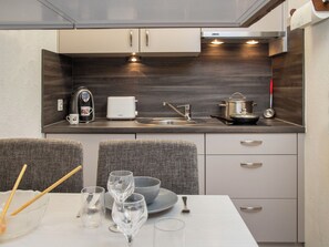 Fridge, highchair, cookware/dishes/utensils