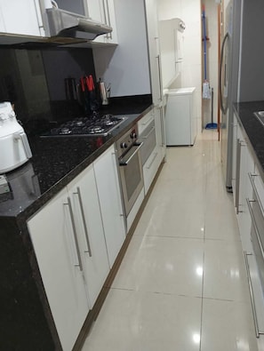 Microwave, oven, coffee/tea maker, cookware/dishes/utensils