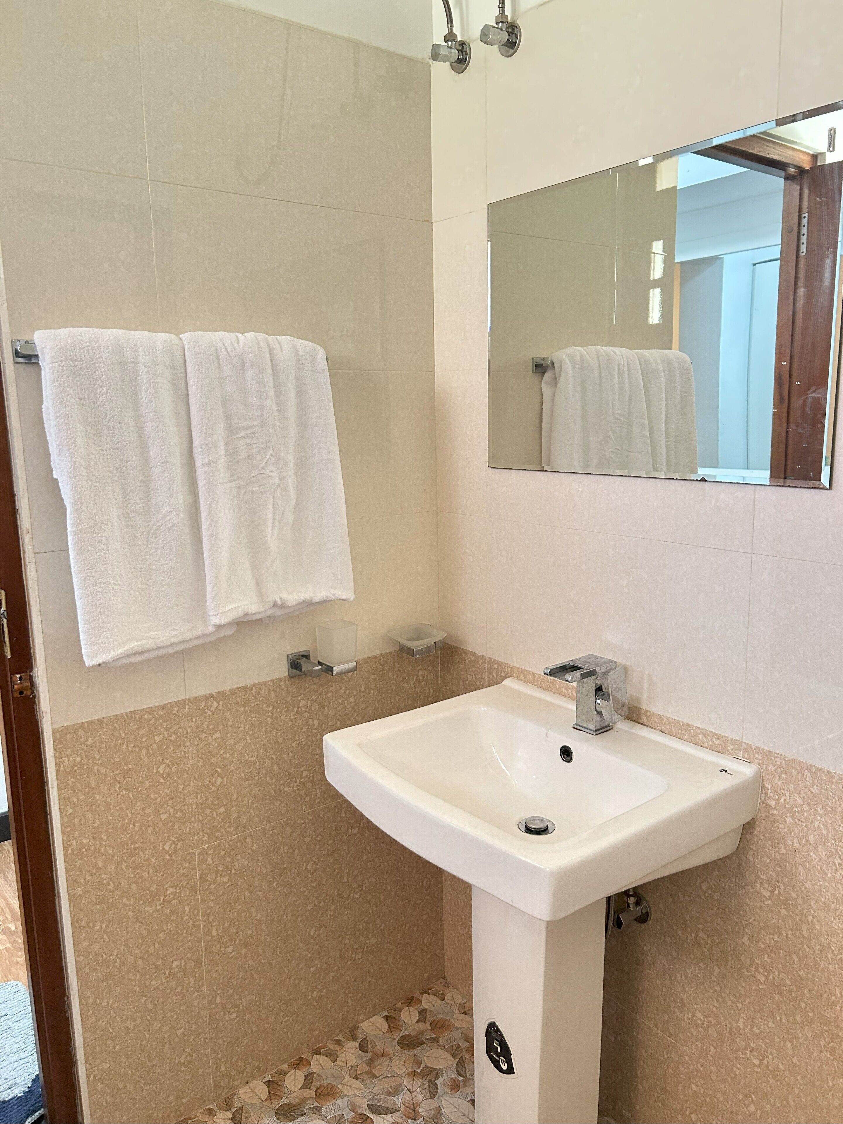 Shower, towels, toilet paper