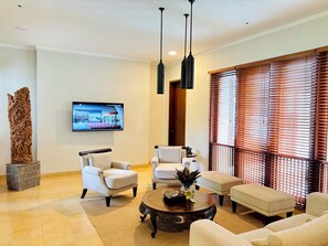 Deluxe Double Room, 1 King Bed, Non Smoking, Garden View | Living area | 45-inch flat-screen TV with cable channels, Netflix, streaming services