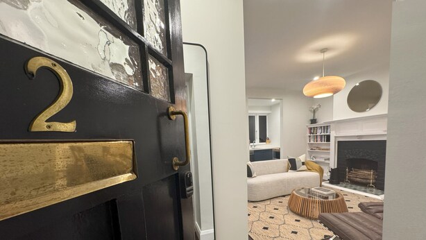 A black door with a brass number '2' and a brass mail slot. - Discerning Accommodation in Thorndon (Wellington)