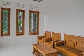 Deluxe Double Room, Balcony, Garden View | Living area | LED TV