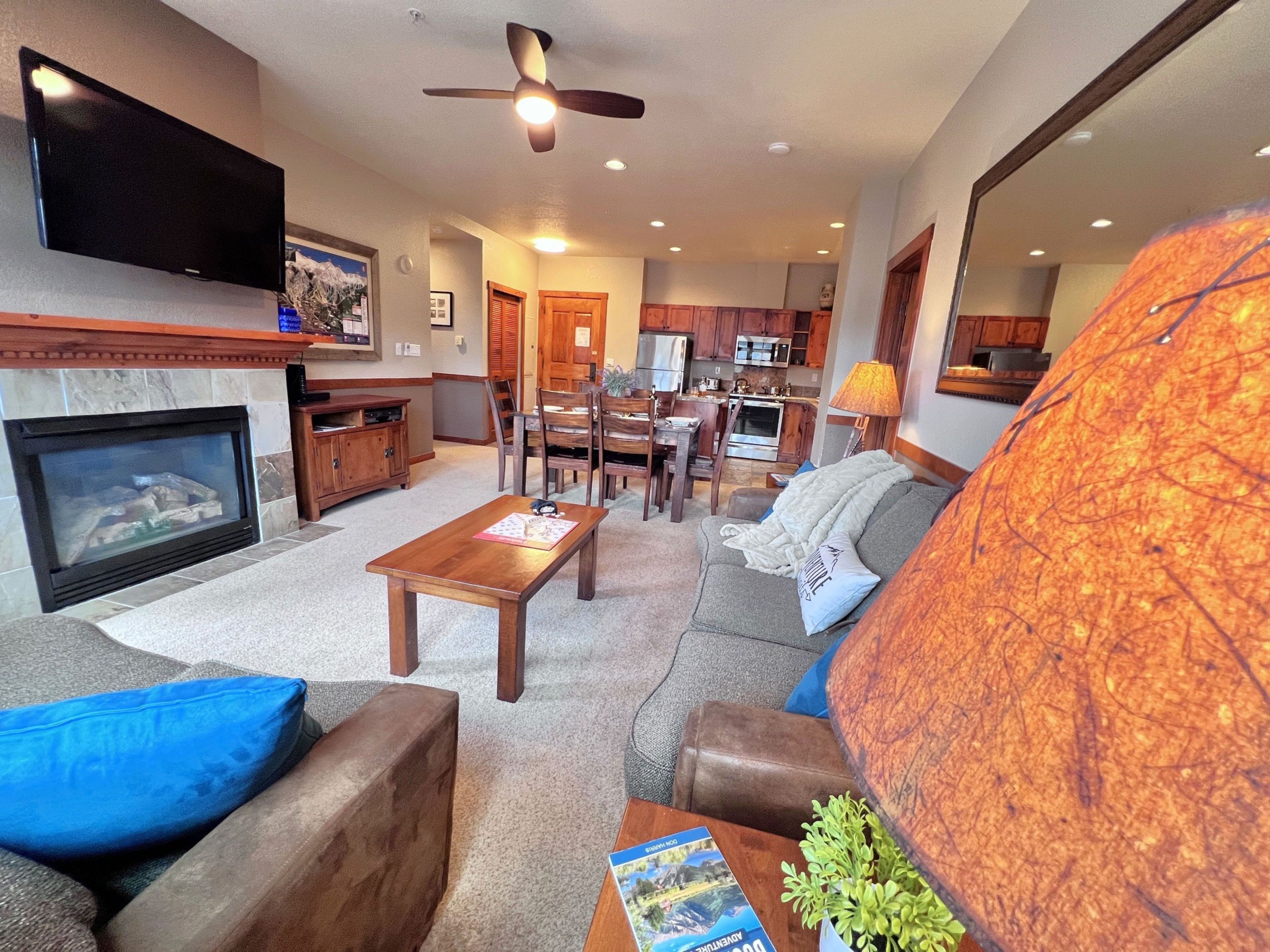 A living room with a fireplace, television, and seating area.