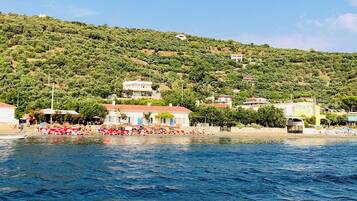 On the beach, sun-loungers, beach towels