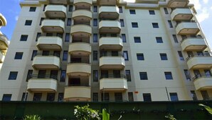A multi-story building with balconies on each floor. - Westlands Gardens Apartment (Nairobi)