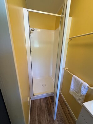 Shower, towels, soap, toilet paper