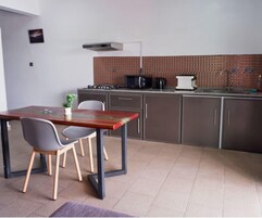 Apartment, 1 Bedroom, Balcony | Private kitchen | Fridge, microwave, stovetop, highchair