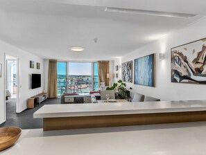 Deluxe Apartment, Pool View | Living area | 45-inch Smart TV with cable channels