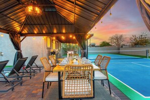 Outdoor dining - 5BR Poolside Pickleball Retreat with Outdoor Oasis (North Las Vegas)