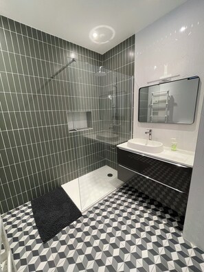 Shower, hair dryer, towels, soap